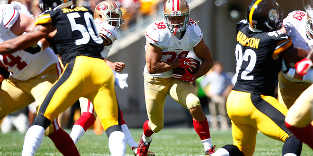 Jarryd Hayne #38 of the San Francisco 49ers runs with the ball in the first quarter against the Pittsburgh Steelers