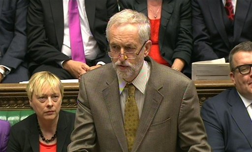 The leader of Britain's opposition Labour party Jeremy Corbyn right stands for the national anthem during the 75th anniversary Battle of Britain memorial service at St Paul's Cathedral in London Tuesday Sept. 15 2015. The Battle of Britain