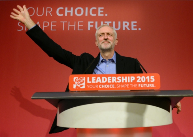 Jeremy Corbyn takes to the stage after he was announced as the Labour Party's new leader at a special conference at the QEII Centre in London