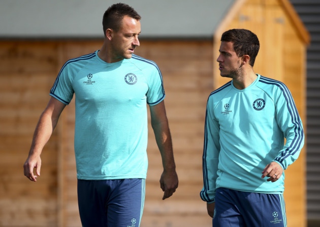 John Terry and Eden Hazard of Chelsea chat during a training session