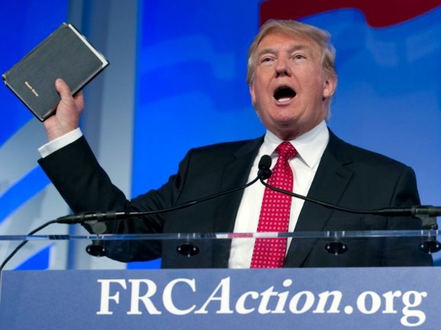 Donald Trump holds up his Bible while speaking at the Values Voter Summit in Washington on Sept. 25 2015