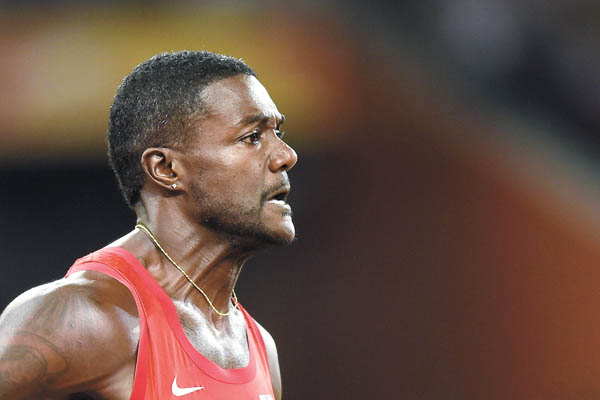 Justin Gatlin competes in the men’s 200-meter qualifying race at the 2015 IAAF World Championships in Beijing on Tuesday