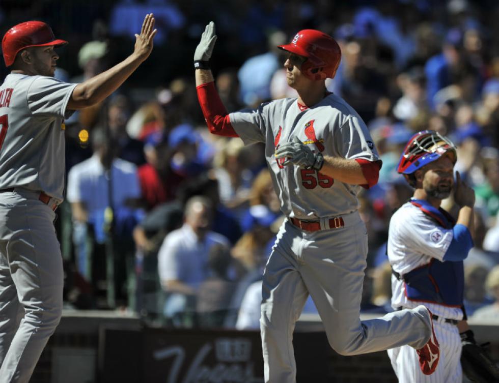 Associated Press
St. Louis Cardinals’ Stephen Piscotty celebrates with teammate Jhonny Peralta after hitting a home run against the Chicago Cubs on Sunday in Chicago