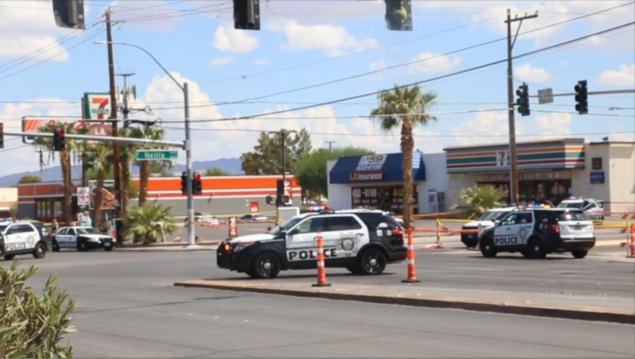 Two Las Vegas cops were ambushed while in their patrol vehicle on Sunday. One officer was struck in the hand