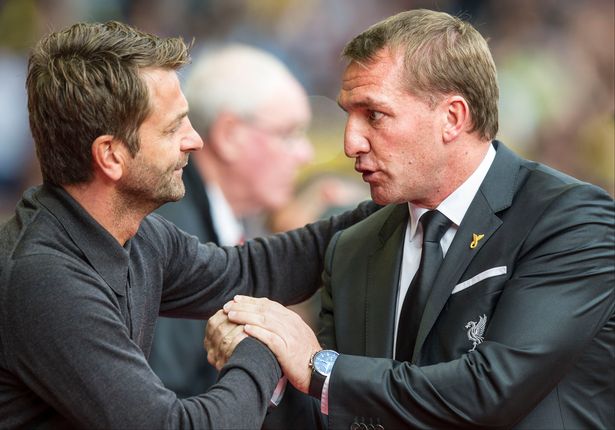 Liverpool manager Brendan Rodgers right chats with Aston Villa manager Tim Sherwood before kick-off at Anfield