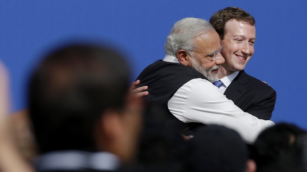 Indian PM Modi hugs Facebook CEO Zuckerberg