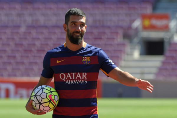 AFP  File  Lluis GeneBarcelona's new player Turkish Arda Turan gestures during his official presentation at the Camp Nou stadium in Barcelona after signing his new contract with the Catalan club