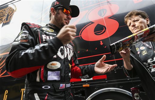 Driver Martin Truex Jr. signs autographs for fans before practice for Sunday's NASCAR Sprint Cup series auto race at New Hampshire Motor Speedway in Loudon N.H. Friday Sept. 25 2015