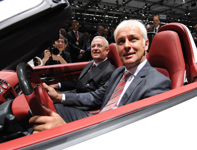 Mueller right and Volkswagen CEO Martin Winterkorn sit in a Porsche Boxster S during the Porsche shareholders meeting in Stuttgart southern Germany. A Volksw