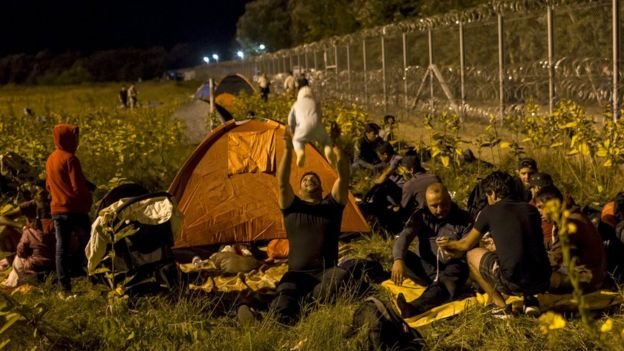 Migrants spent the night out in the open on the Serbian side of the border with Hungary