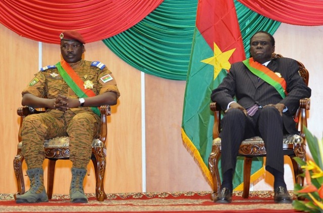 21 2014 in Ouagadougou shows Interim President of Burkina Faso Michel Kafando and Prime Minister Lt. Col. Isaac Zida listening during Kafando's inauguration ceremony. The presidential guard in Burkina Faso