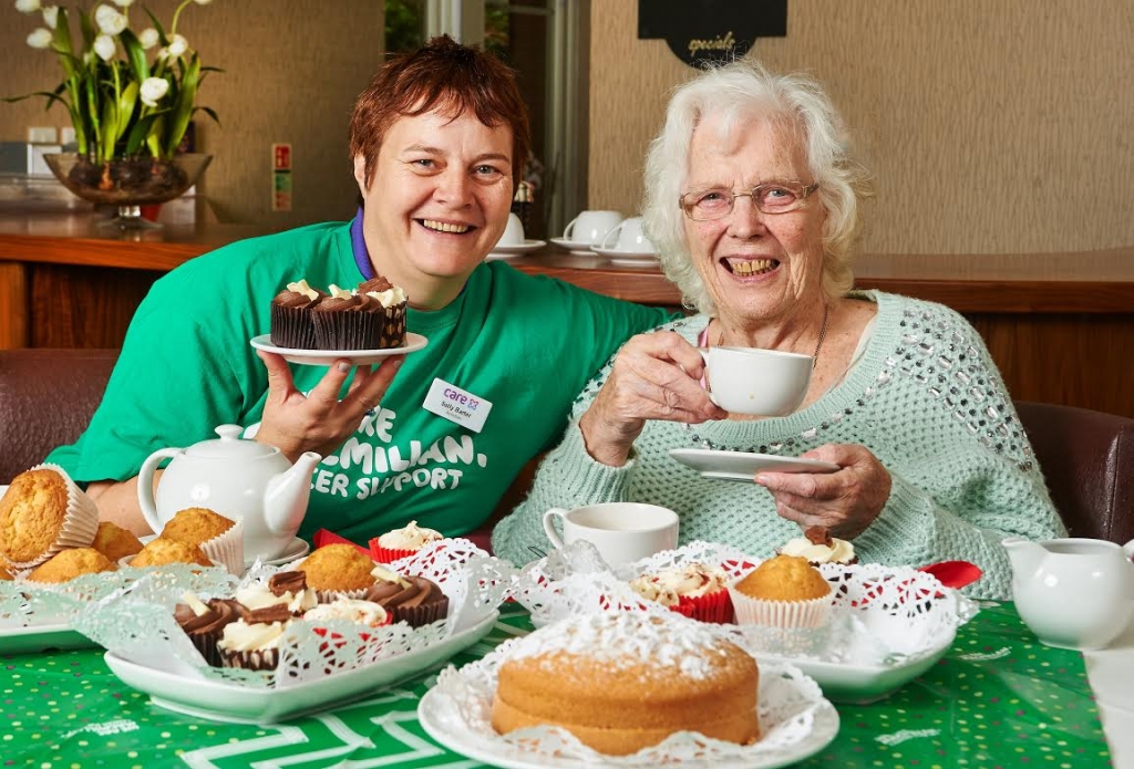 2015 Halstead UK. Care UK Colne View Mac Millan Coffee Morning promotion from left Activities co ordinator Sally Barter and resident Doreen Purkiss