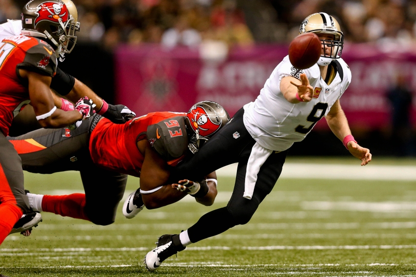 Oct 5 2014 New Orleans LA USA Tampa Bay Buccaneers defensive tackle Gerald Mc Coy pressures New Orleans Saints quarterback Drew Brees as he throws during the second quarter of a game at Mercedes Benz Superdome. Mandatory Credit Derick E. Hin