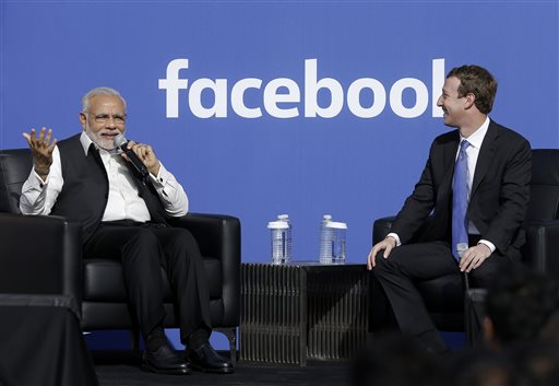 Indian Prime Minister Narendra Modi and Facebook CEO Mark Zuckerberg speak on stage during a town hall at Facebook's headquarters in Menlo Park California September 27. &mdash Reuters