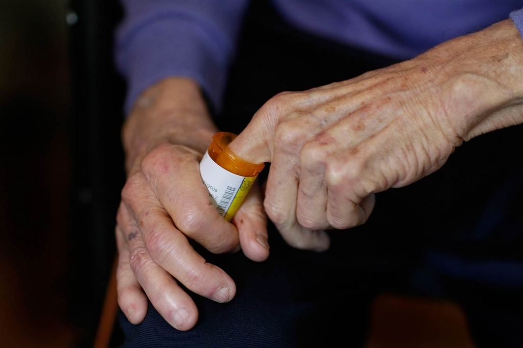 A man reaches into a medicine bottle in Miami Florida on Feb. 25 2009. Joe Raedle  Getty Images file