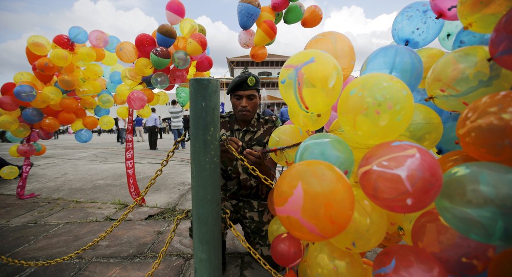 Nepalese army personnel decorates the premises of the parliament with balloons before President Ram Baran Yadav formally promulgates the new constitution in Kathmandu Nepal