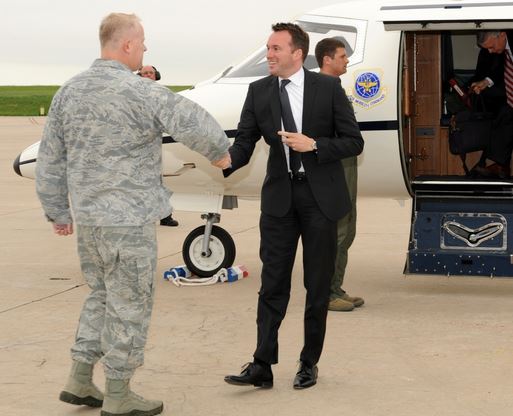 Eric Fanning greets Col. Dan Dant 460th Space Wing commander at Buckley Air Force Base Colo. in 2013