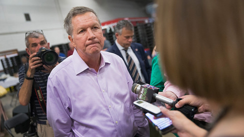 Ohio Governor John Kasich speaks to reporters