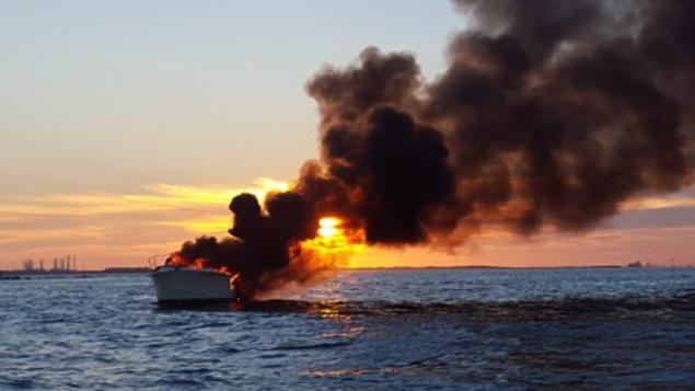 Four people are lucky to be alive after they were rescued from this burning yacht near Galveston Texas on Saturday