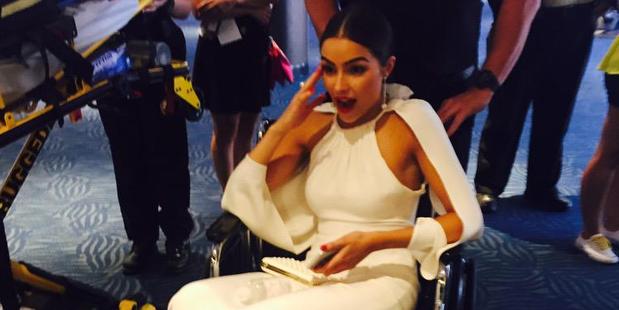 Olivia Culpo recovers in a wheelchair after nearly passing out at the Emmys