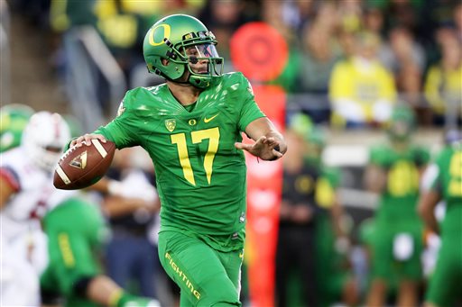 Oregon quarterback Jeff Lockie looks to pass during the first half of an NCAA college football game against Utah Saturday Sept. 26 2015 in Eugene Ore