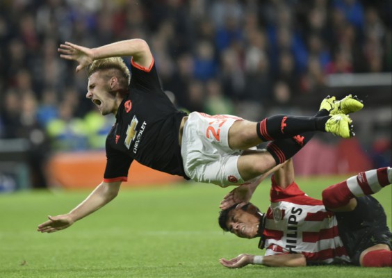 AFP  File  John ThysManchester's defender Luke Shaw is challenged by Eindhoven's Mexican defender Hector Moreno during the UEFA Champions League Group B football match in Eindhoven the Netherlands