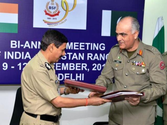 BSF Director General D.K. Pathak and Maj. Gen. Umar Farooq Burki DG Pakistan Rangers, exchanging documents in New Delhi on Saturday