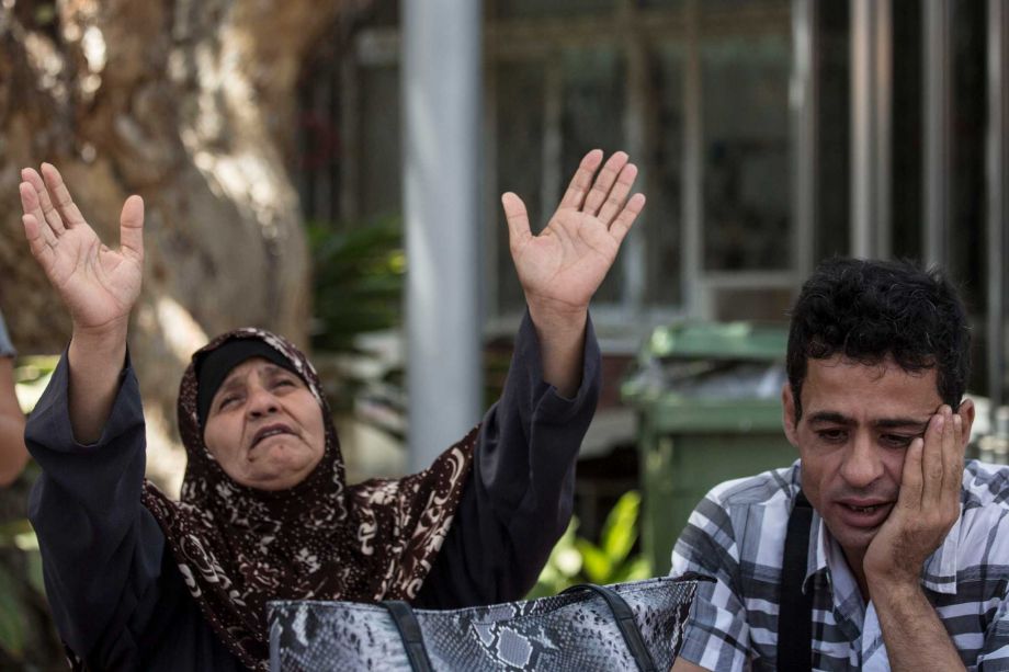 Mazoza Allan left and Amid Allan mother and a brother of Mohammed Allan a Palestinian prisoner who was then on a hunger strike wait outside Barzilai hospital in Ashkelon southern Israel. Israeli