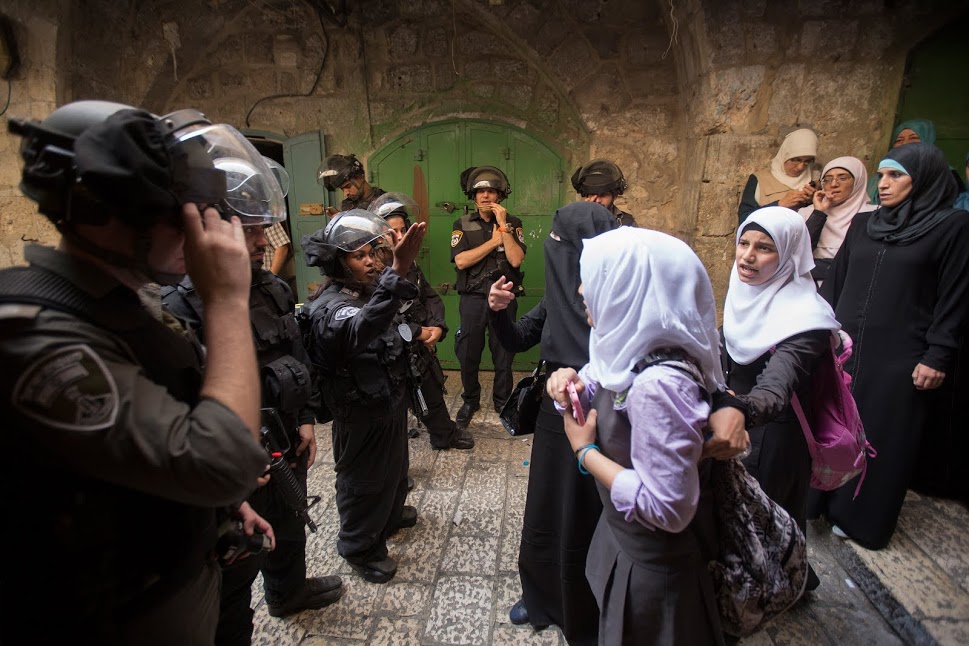 Palestinian women face off with Border Police officers in Jerusalem’s Old City