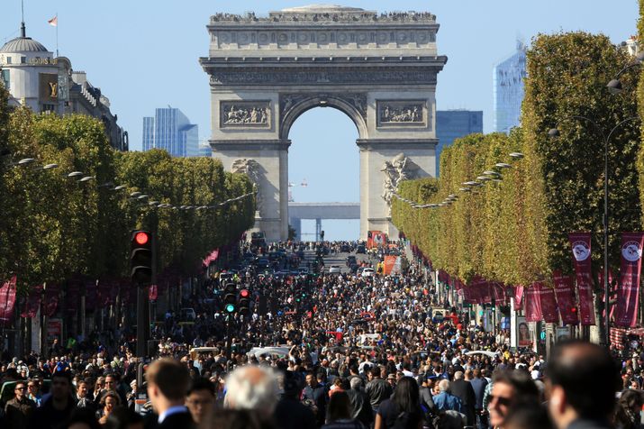 People walk on the Champs Elysees during the