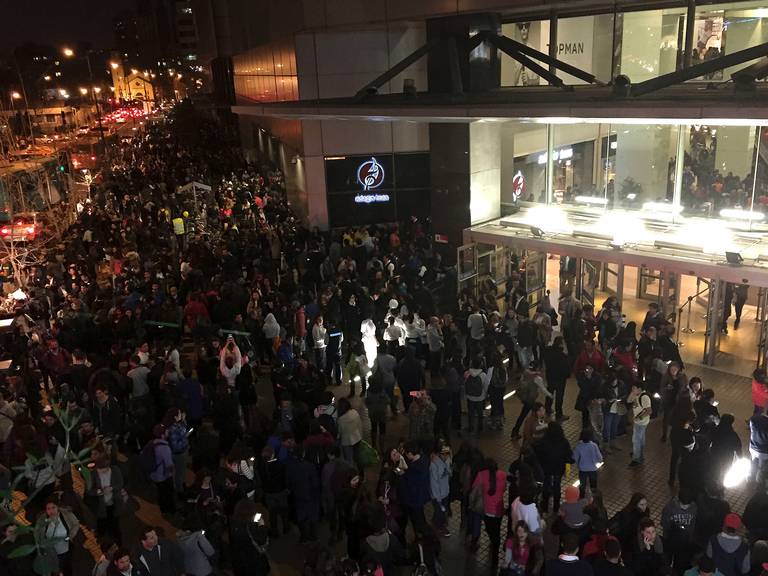 People evacuate a mall in Santiago after a powerful earthquake in Santiago Chile