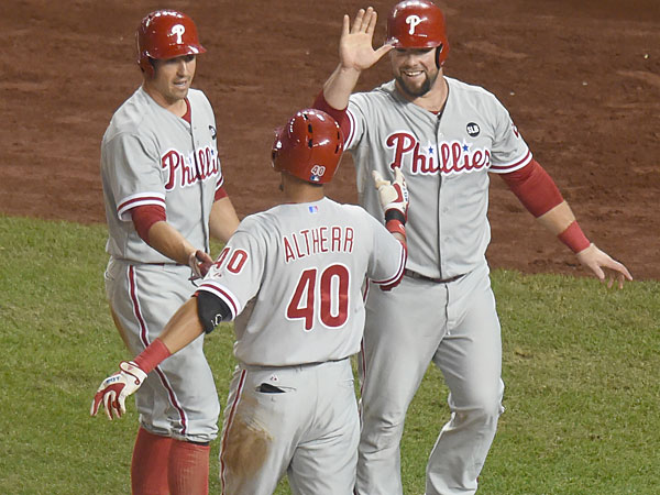 Aaron Altherr celebrates hitting an inside the park grand slam home run in the second inning with Cameron Rupp and Brian Bogusevic