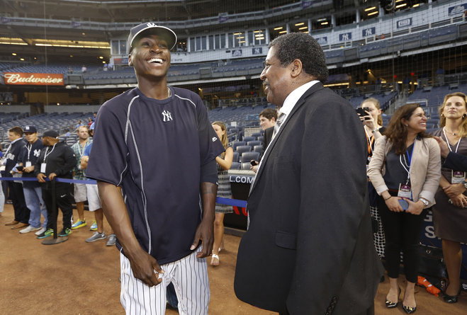 New York Yankees shortstop Didi Gregorius left of Curacao meets Curacao Prime Minister Ben Whiteman on the field before a baseball game against the Boston Red Sox at Yankee Stadium in New York Tuesday Sept. 29 2015. Whiteman is in New york attending