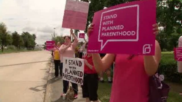 Supporters of Planned Parenthood rally outside Houston offices