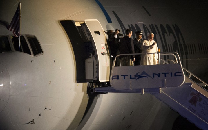 Pope Francis waves to the crowd at Philadelphia International Airport in Philadelphia as he departs for Rome on Sunday Sept. 27 2015. Pope Francis wrapped up his 10-day trip to Cuba and the United States on Sunday