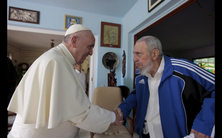 Pope Francis and Cuba's Fidel Castro shakes hands in Havana Cuba Sunday Sept. 20 2015. The Vatican described the 40-minute meeting at Castro's residence as informal and familial with an exchange of books