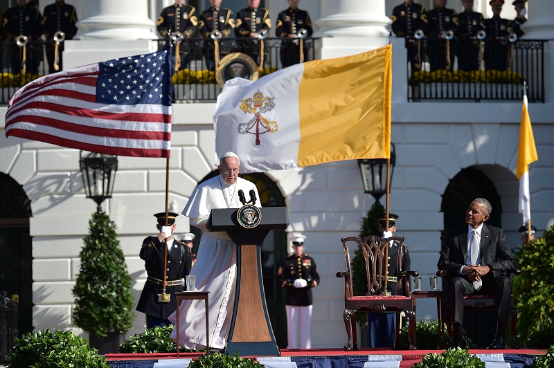 Pope Francis speaks during arrival ceromonies with US President Barack Obama at the White House