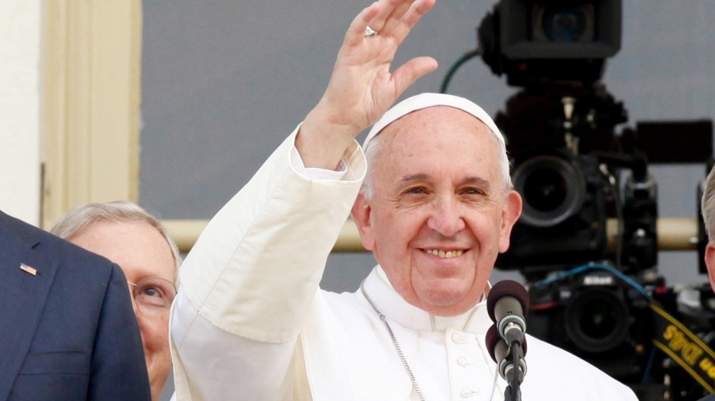 Pope Francis waves to the crowd after addressing Congress Thursday