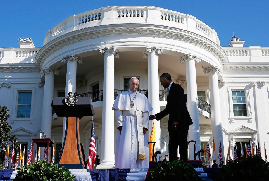 President Barack Obama welcomes Pope Francis during an arrival ceremony at the White House on Wednesday. He devoted much of his remarks to climate change