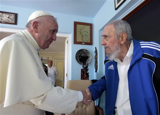 Pope Francis and Cuba's Fidel Castro shake hands in Havana Cuba Sunday Sept. 20 2015. The Vatican described the 40-minute meeting at Castro's residence as informal and familial with an exchange of books