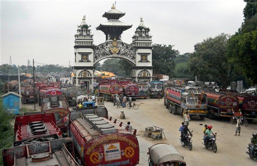 Nepalese oil tankers and commercial trucks stand stranded near a gate that marks the Nepalese border with India in Birgunj Nepal Thursday Sept. 24 2015. Nepals top political parties on Thursday reached out to protesters angry about the countrys