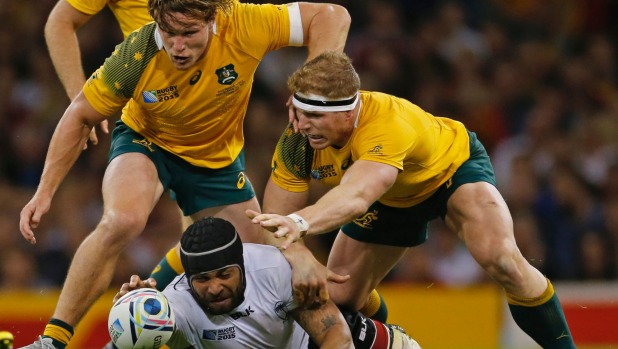 Fiji's Netani Talei is tackled by Australia's Michael Hooper and David Pocock in their RWC pool match