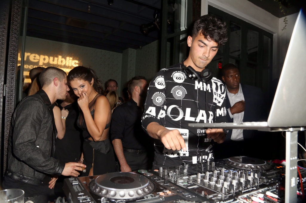 WEST HOLLYWOOD CA- AUGUST 30  Nick Jonas Selena Gomez and Joe Jonas attend Republic Records 2015 VMA after party at Ysabel