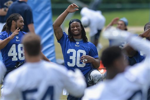 St. Louis Rams rookie running back Todd Gurley stretches during an NFL football organized team activity Thursday