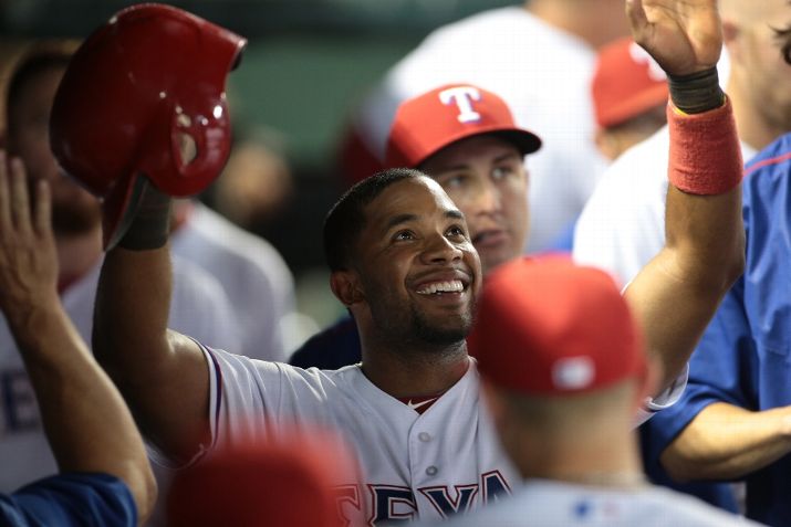 ARLINGTON TX- SEPTEMBER 17 Elvis Andrus #1 of the Texas Rangers looks on from the dugout celebrating with teammates after scoring in the eighth inning against the Houston Astros at Global Life Park in Arlington