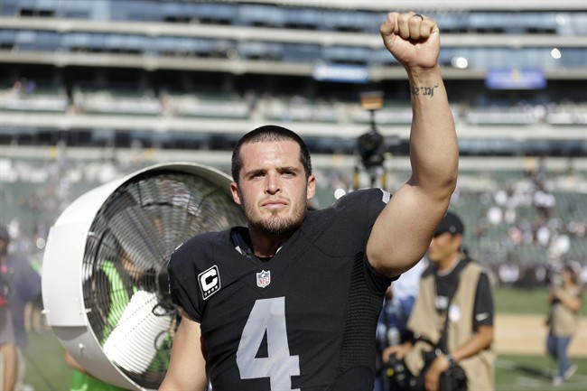 Oakland Raiders quarterback Derek Carr celebrates after a 37-33 win over the Baltimore Ravens during an NFL football game in Oakland Calif. Carr threw a 12-yard touchdown pass to Seth Roberts with 26 seconds left