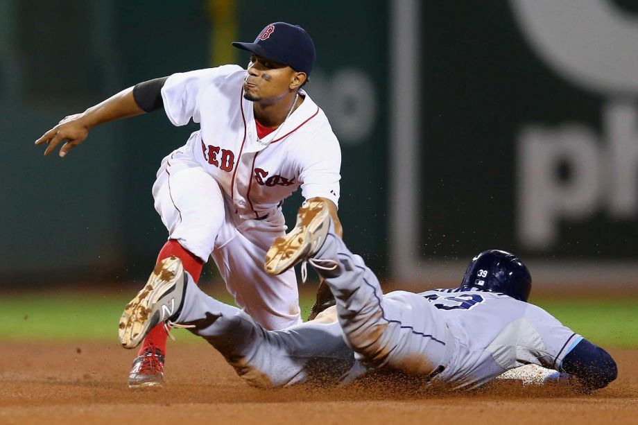 BOSTON MA- SEPTEMBER 24 Xander Bogaerts #2 of the Boston Red Sox tags out Kevin Kiermaier #39 of the Tampa Bay Rays during the ninth inning at Fenway Park