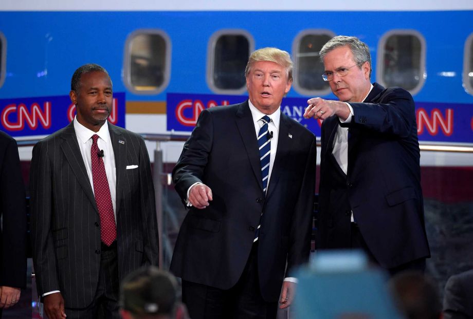 16 2015 Republican presidential candidates from left Ben Carson Donald Trump and former Florida Gov. Jeb Bush chat during the CNN Republican presidential debate at the Ronald Reagan Presidential Library and Museu