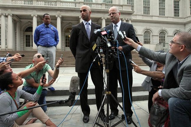 James Blake center left talks to members of the media as his attorney Kevin H. Marino center right looks on outside City Hall in New York after leaving the building Monday Sept. 21 2015. Blake a former tennis star was tackled during a mistaken arr