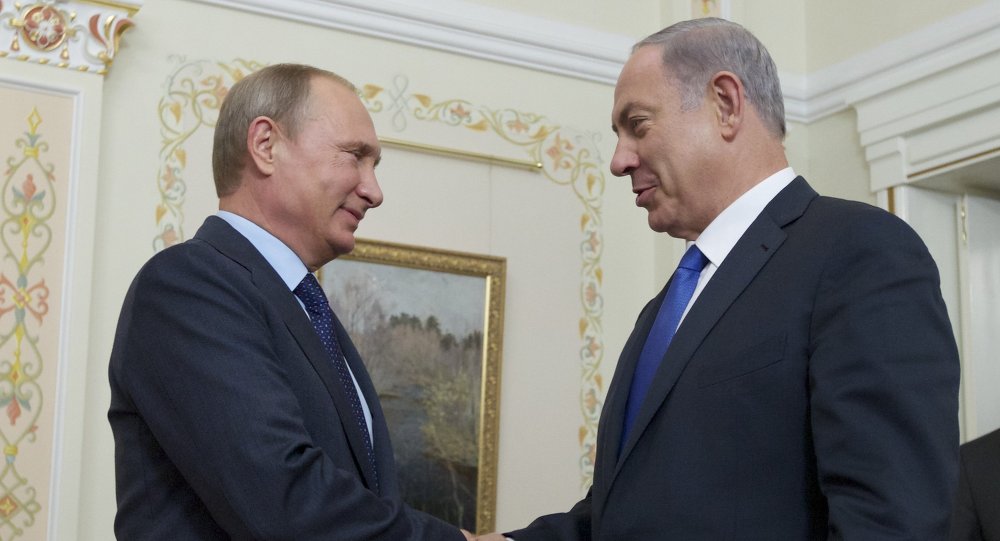 Russian President Vladimir Putin shake hands with Israeli Prime Minister Benjamin Netanyahu during a meeting at the Novo Ogaryovo residence outside Moscow